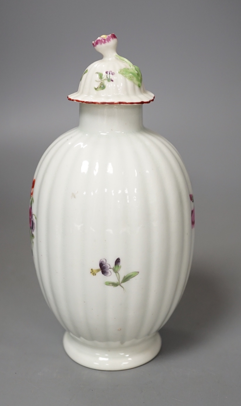 A Worcester tea canister and rare cover painted with flowers on a fluted body c.1770. 16.5cm